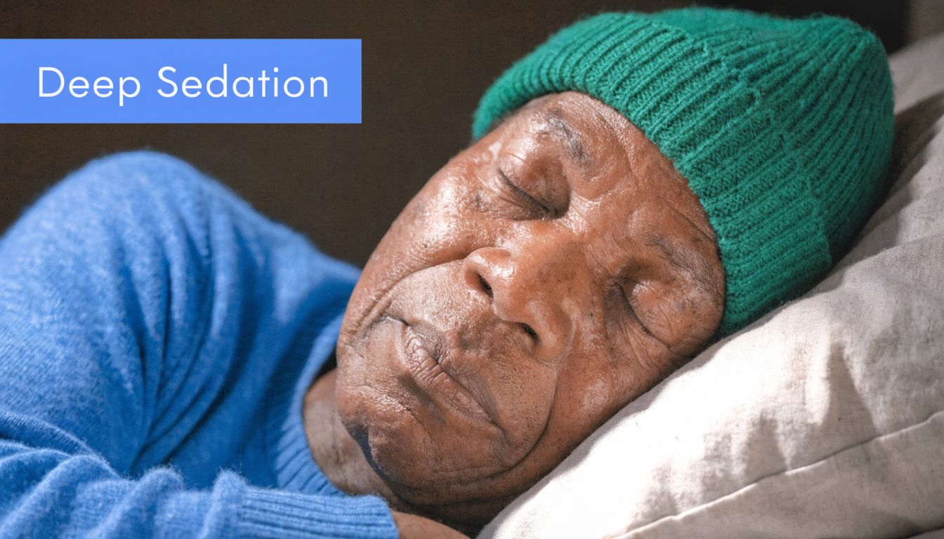 An elderly person with a green beanie sleeping peacefully in bed, representing deep sedation and rest.