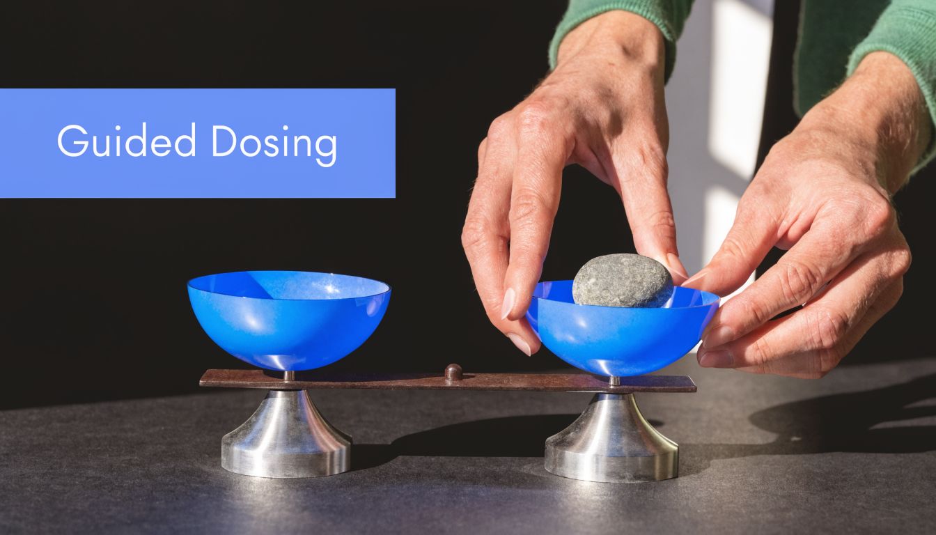 Hands carefully placing a small grey stone into a blue plastic bowl on a balanced scale.