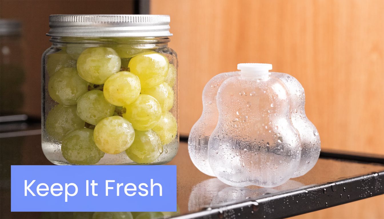 A glass jar filled with fresh green grapes sitting next to a translucent fruit-shaped container.
