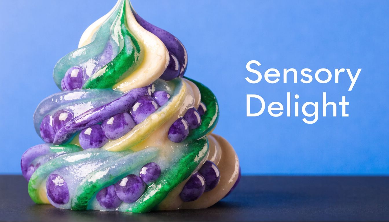 A colorful swirl of grape-colored mochi dough textured with small beads against a bright blue background.