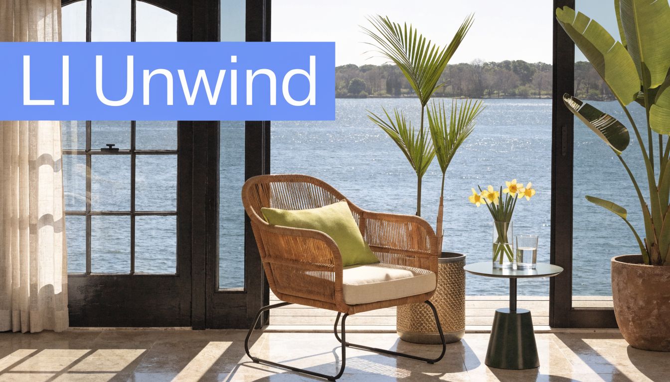A comfortable wicker armchair with a green cushion placed by a large window overlooking a calm lake.