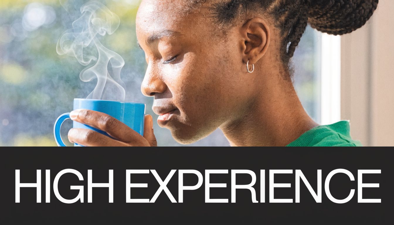A person with eyes closed enjoying the steam rising from a blue mug of hot beverage.